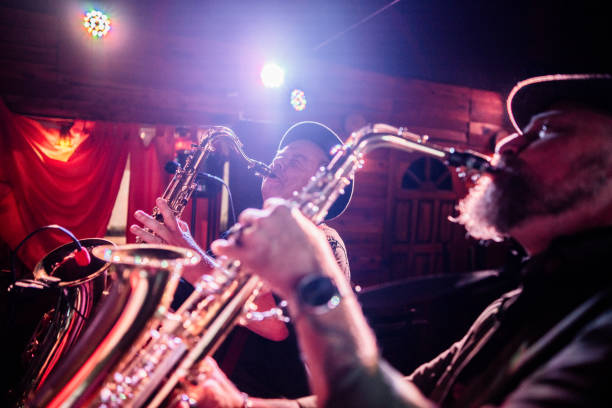 Musicians playing saxophone at nightclub